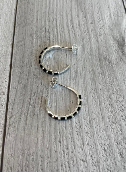 Sterling silver and black onyx hoop earrings, flat lay showing post and hoop detail